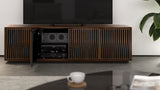 BDi Elements 8703 Media + Storage Cabinet in Natural Walnut, one door open with media equipment, in a living room, with Tune door fronts