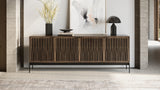 BDi Elements 8709 Media + Storage Console in Natural Walnut, front view under a lamp and art, with Tune door fronts