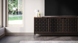 BDi Elements 8709 Media + Storage Console in Toasted Oak, under a TV by a garden window, with Constellation door fronts