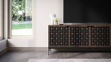 BDi Elements 8709 Media + Storage Console in Natural Walnut, under a TV by a garden window, with Constellation door fronts