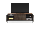 BDi Elements 8709 Media + Storage Console in Natural Walnut, outer doors open with a TV and media equipment, on white, with Tune door fronts