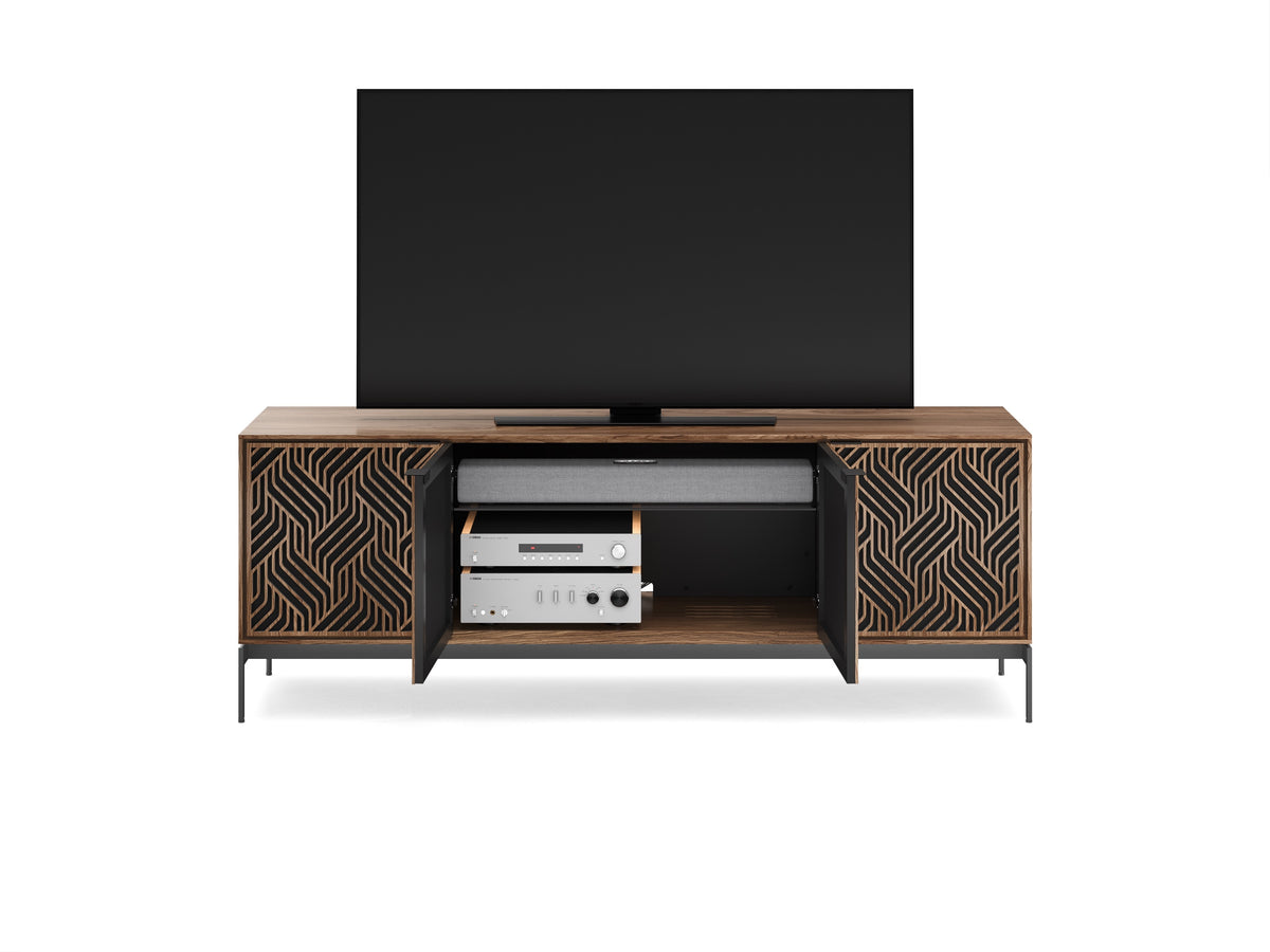 BDi Elements 8709 Media + Storage Console in Natural Walnut, middle doors open with a TV and media equipment, on white, with Weave door fronts