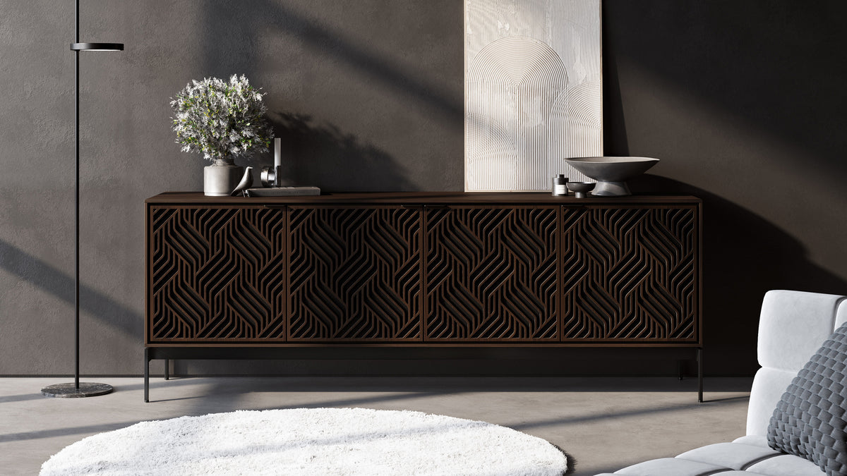 BDi Elements 8709 Media + Storage Console in Toasted Oak, against a dark wall in a living room, with Weave door fronts
