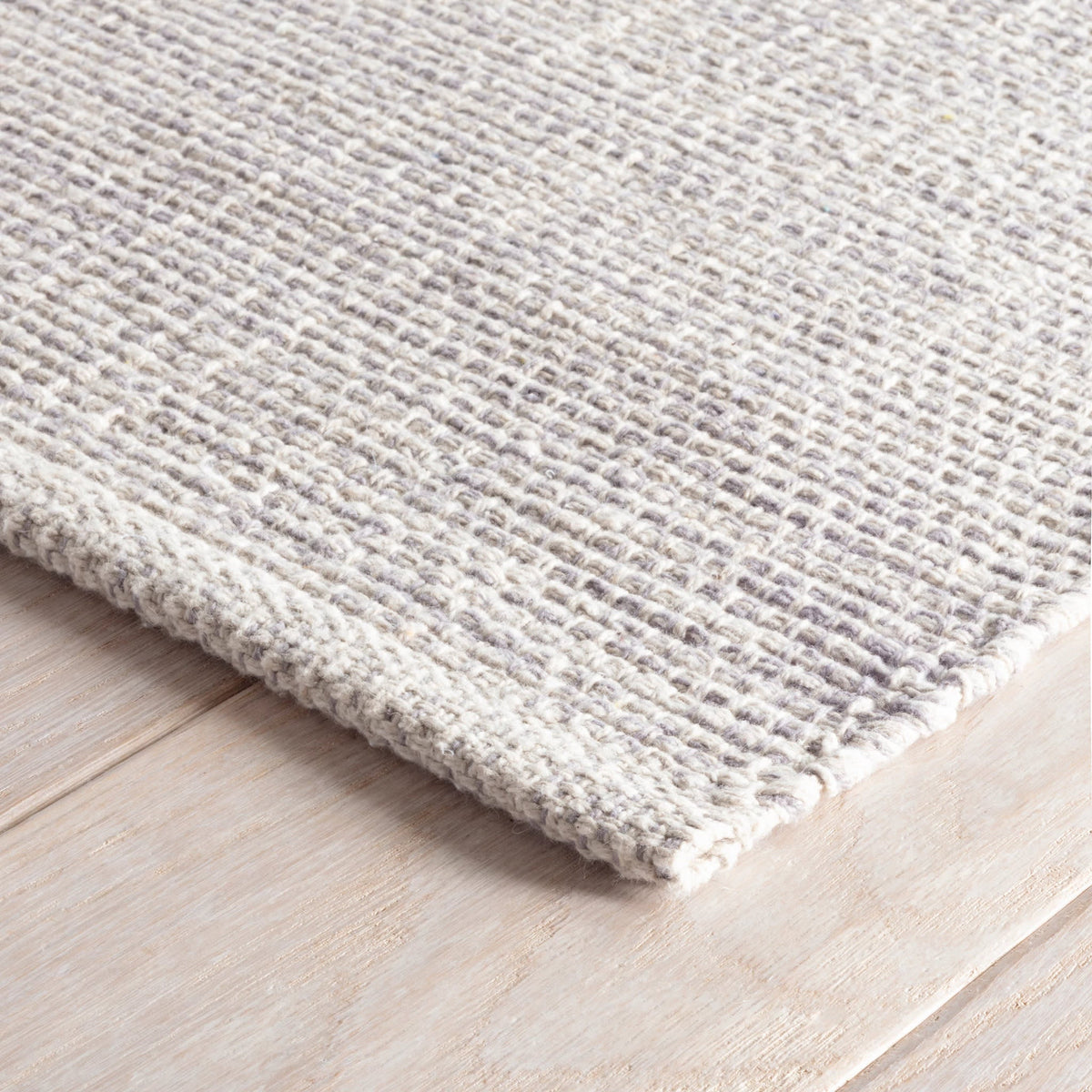 Dash & Albert Marled Handwoven Cotton Rug in Grey, corner detail