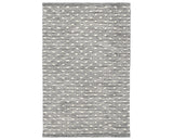 Rug with a Hobnail Handwoven pattern on a plain background