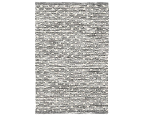 Rug with a Hobnail Handwoven pattern on a plain background