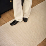 Dash & Albert Herringbone Handwoven Indoor/Outdoor Rug in Linen / White, runner underfoot