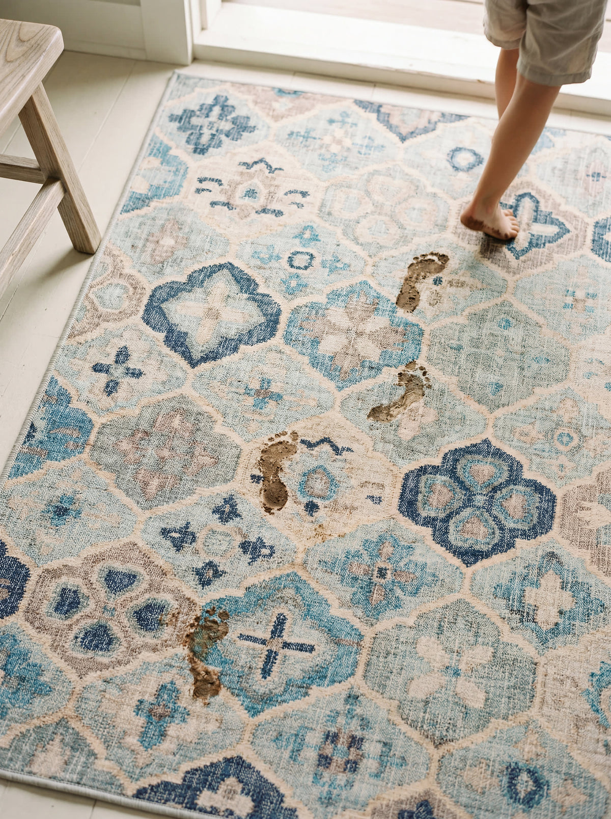 Dash & Albert Pali Machine Washable Rug in Blue, with wet footprints