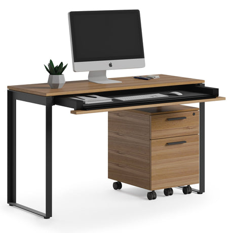 BDi Linea 6222 Console Desk in Natural Walnut, keyboard drawer open, with a mobile file and monitor, on white