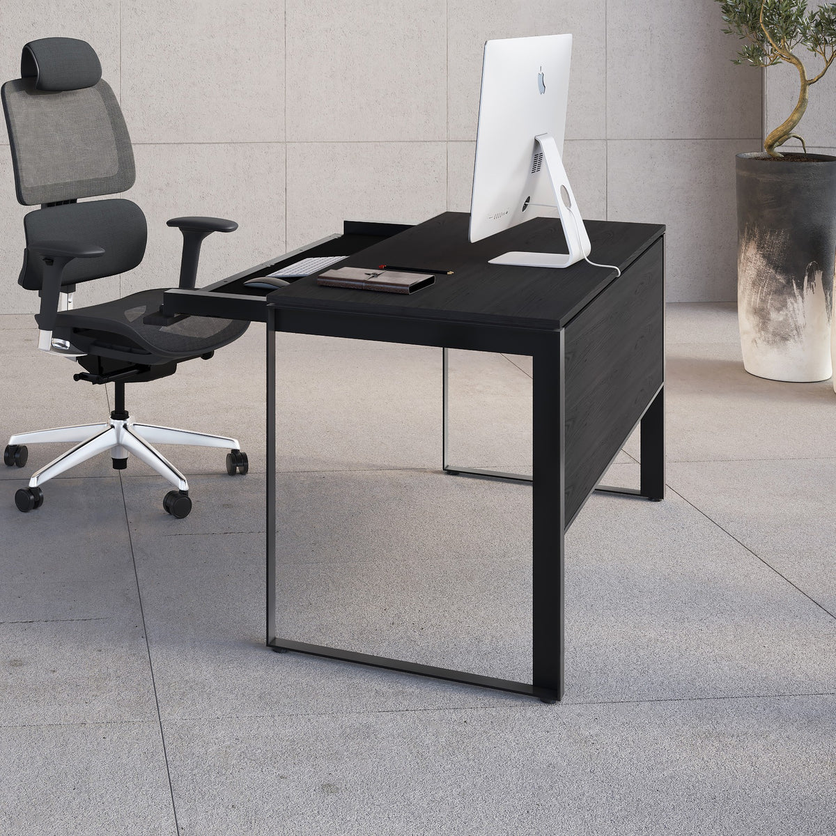 BDi Linea 6221 Desk in Charcoal Stained Ash, in an office with a matching bookcase