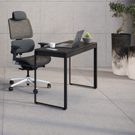 BDi Linea 6222 Console Desk in Charcoal Stained Ash, in an office with a matching bookcase