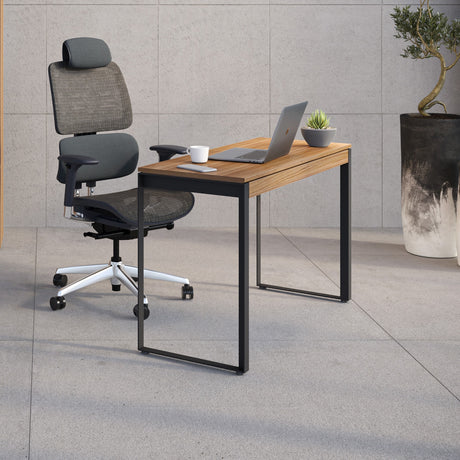 BDi Linea 6222 Console Desk in Natural Walnut, in an office with a matching bookcase