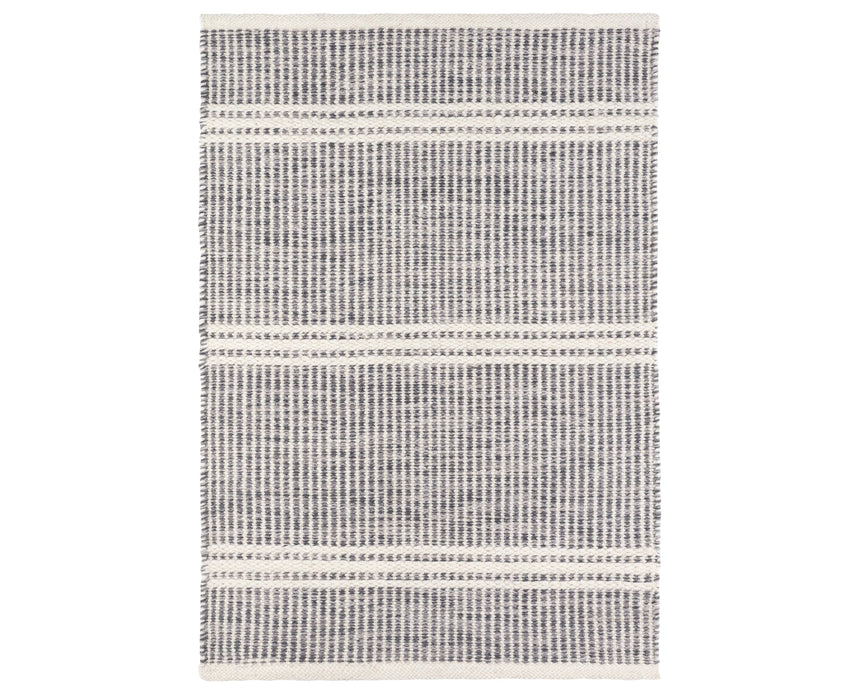 Rug with a Malta Handwoven pattern on a plain background