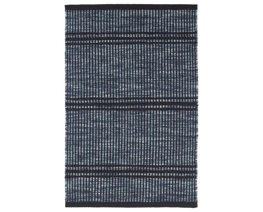 Rug with a Malta Handwoven pattern on a plain background