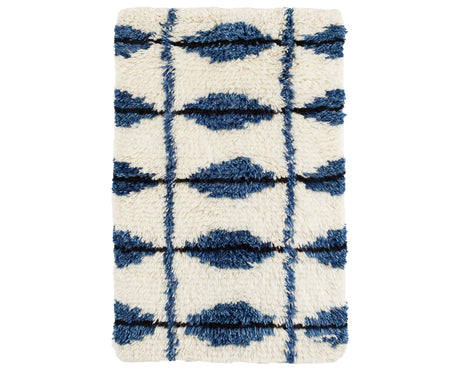 Rug with a Noma Handwoven pattern on a plain background
