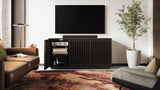 BDi Profile 8477 3-Door Media & Storage Console in Toasted Oak, left door open, in a living room with a TV