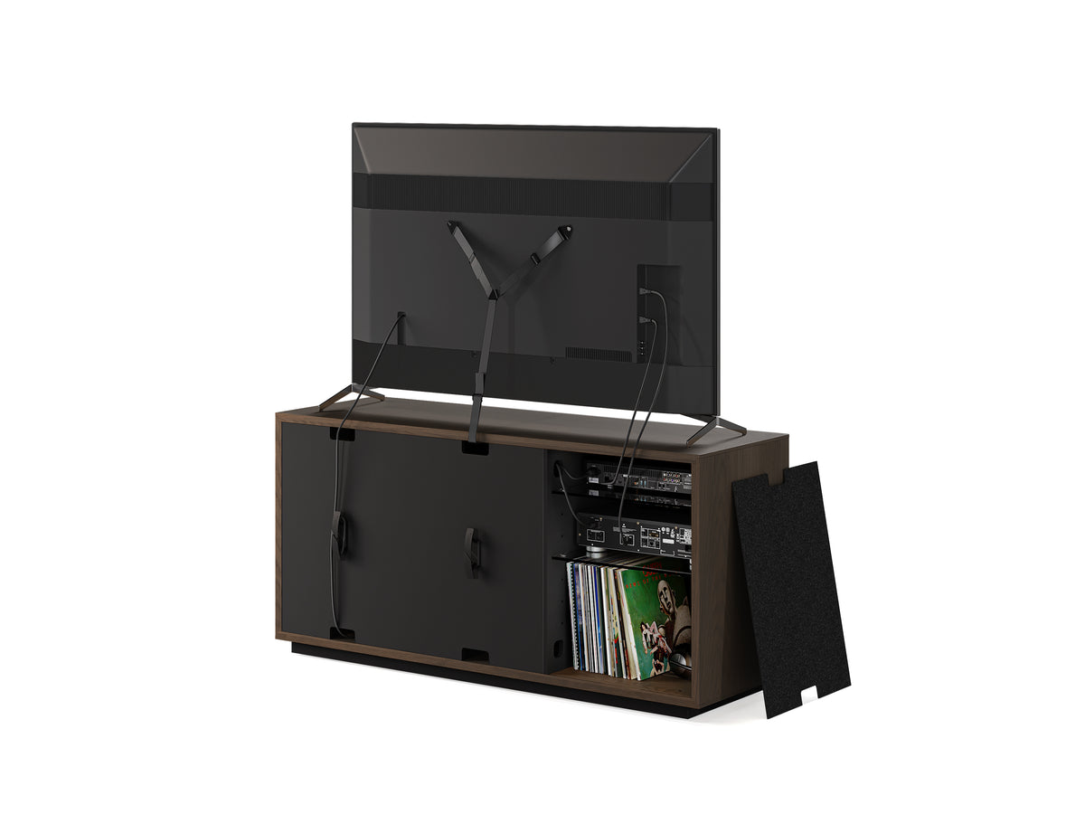 BDi Profile 8477 3-Door Media & Storage Console in Toasted Oak, back view with a TV and a rear panel off, on white