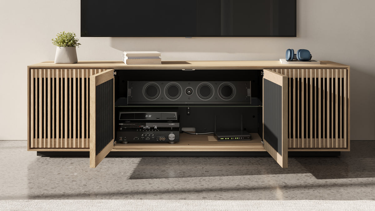 BDi Profile 8479 4-Door Media & Storage Console in Washed Oak, middle doors open with a centre speaker and media equipment