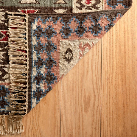Dash & Albert Balsam Kilim Handwoven Wool Rug in Multi, corner turned back
