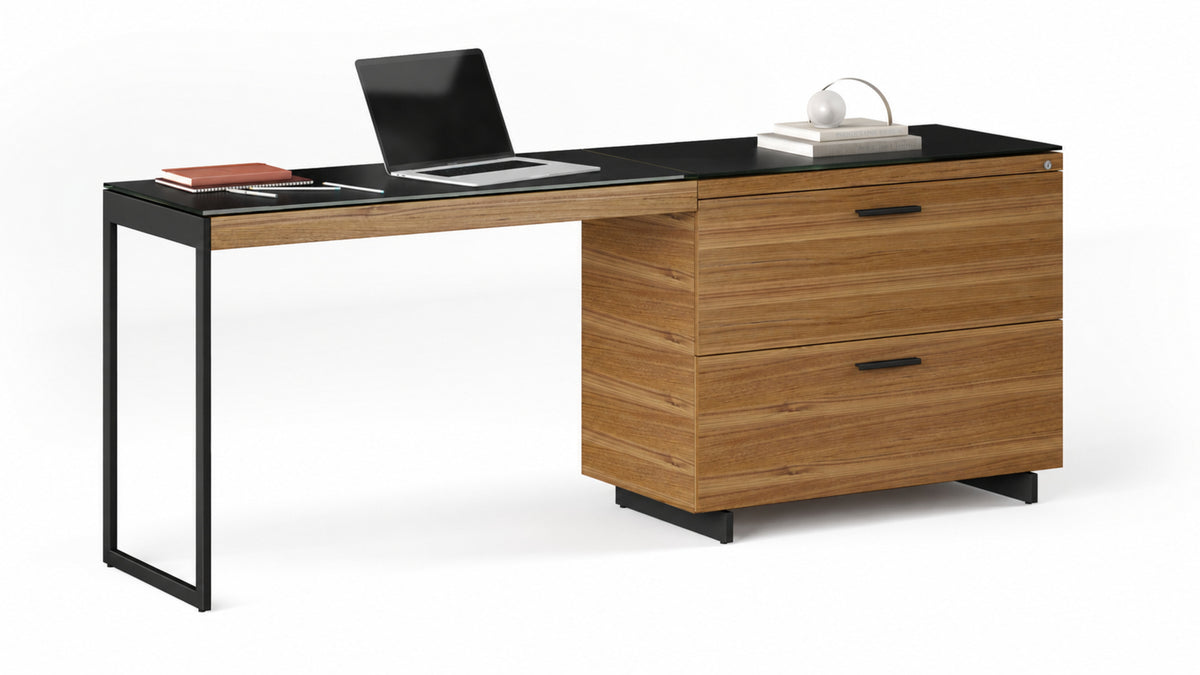 BDi Sequel 20 6116 Lateral File Cabinet in Natural Walnut, with a black base, supporting a desk return, on white