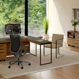 BDi Sequel 20 6112 Desk Extension in Natural Walnut, with a black frame, joined to the desk, in a home office by a window