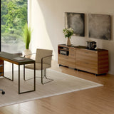 BDi Sequel 20 6116 Lateral File Cabinet in Natural Walnut, with a black base, beside a multi-function cabinet, in a home office by a window