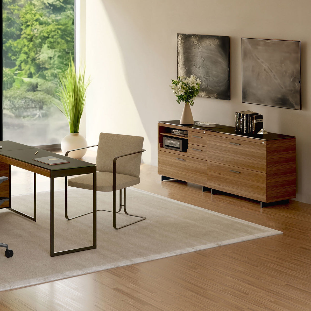 BDi Sequel 20 6117 Multi Function Cabinet in Natural Walnut, with a black base, beside a lateral file, in a home office by a window