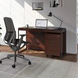 BDi Sequel 20 6103 Compact Laptop Desk in Chocolate Stained Walnut, with a black frame, mobile file and multi-function cabinet, in a home office