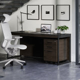 BDi Sequel 20 6101 Desk in Charcoal Stained Ash, with a black frame and mobile file, in an office under a stair