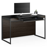 BDi Sequel 20 6103 Compact Laptop Desk in Charcoal Stained Ash, with a black frame, keyboard drawer open, with a monitor, on white