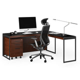 BDi Sequel 20 6112 Desk Extension in Chocolate Stained Walnut, with a black frame, joined to the desk with a mobile file, on white