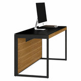 BDi Sequel 20 6101 Desk in Natural Walnut, with a black frame, side view with a monitor, on white