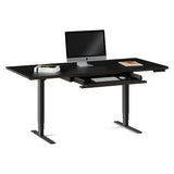 BDi Sequel 20 Sit + Stand Desk in Charcoal Stained Ash, keyboard drawer open, with a monitor, on white