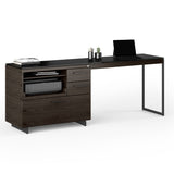 BDi Sequel 20 6112 Desk Extension in Charcoal Stained Ash, with a black frame, on a multi-function cabinet, on white