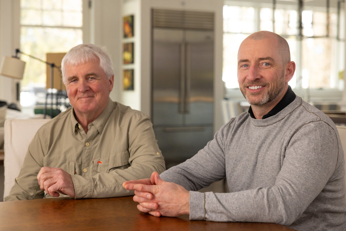 Eric Hicks and his son Scott Hicks seated at a kitchen table