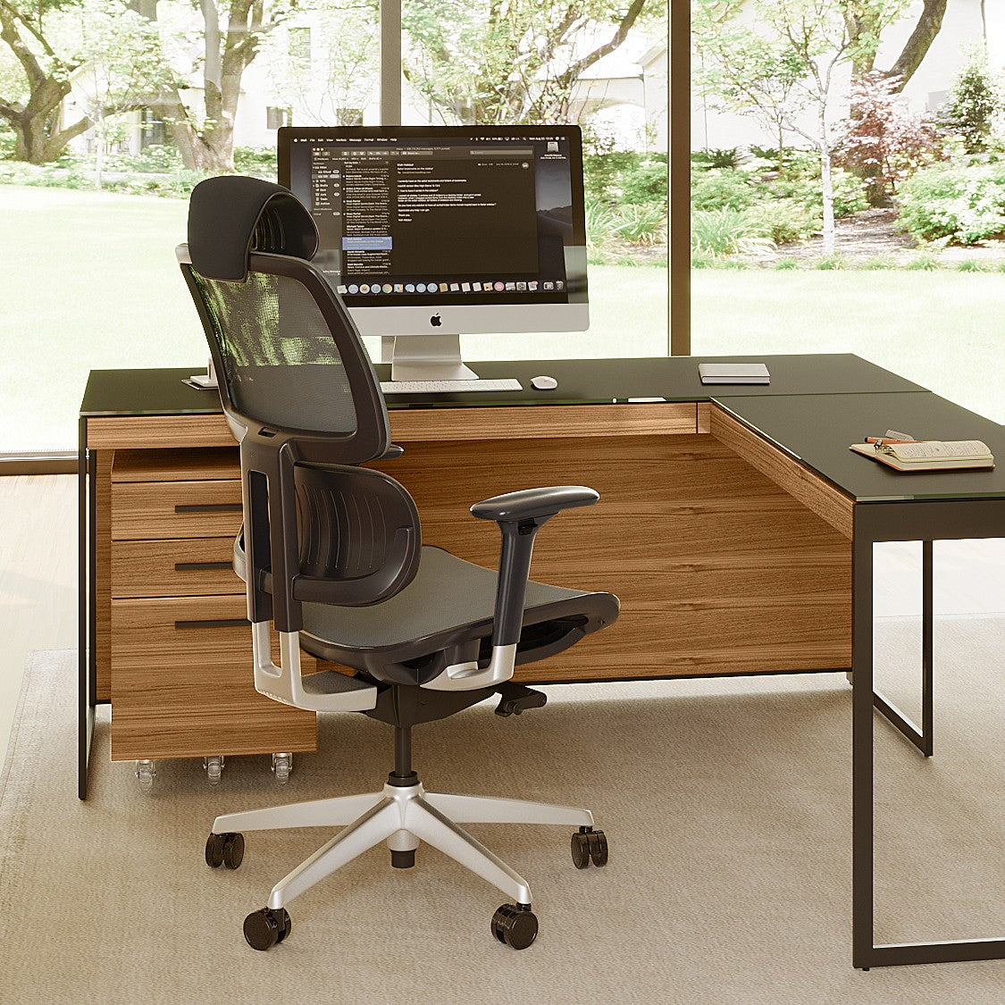 BDi Sequel 20 6101 Desk in Natural Walnut, with a black frame, return and a mesh task chair, in a home office